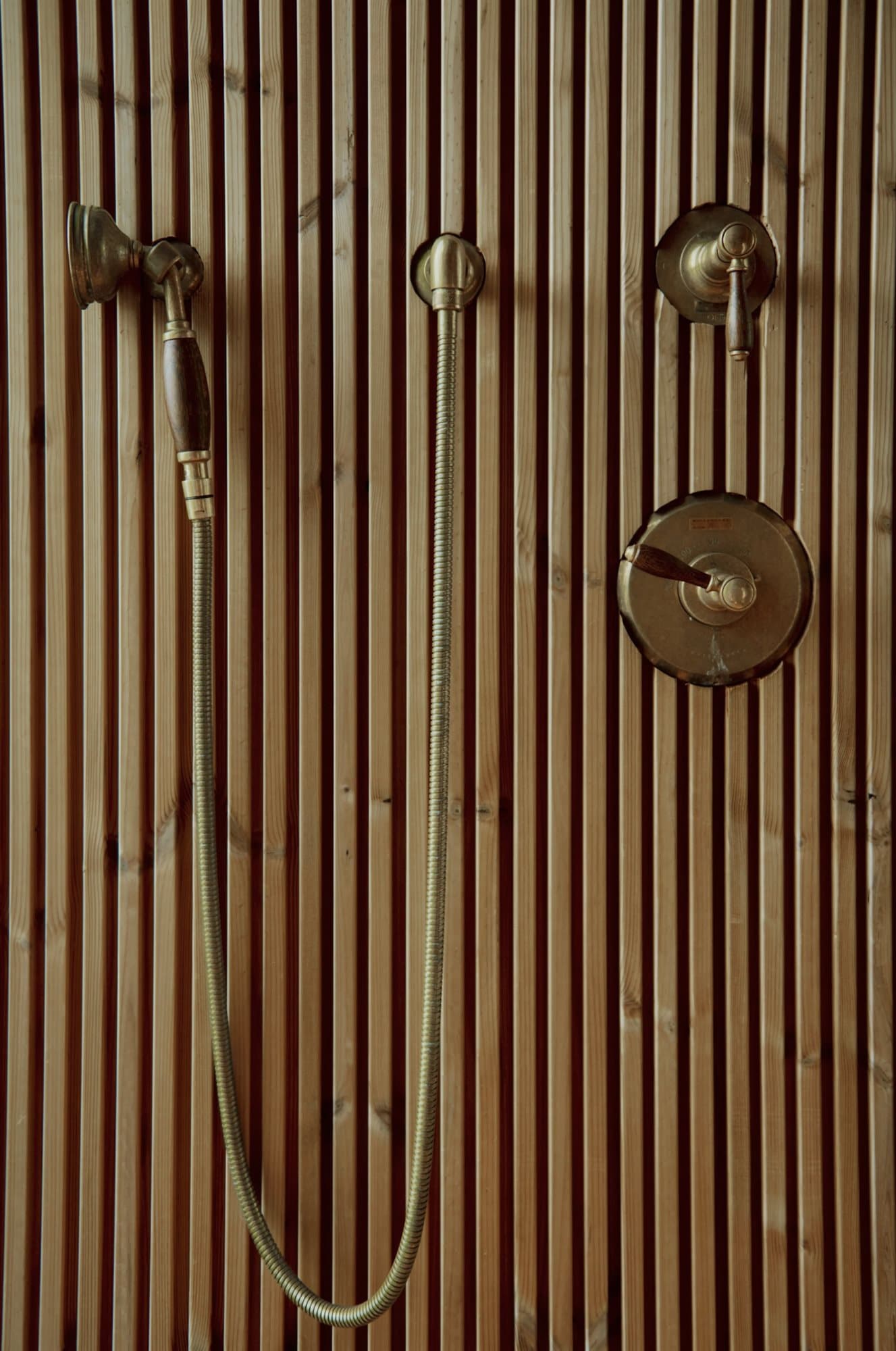 Cedar-slat wall with a round accent window