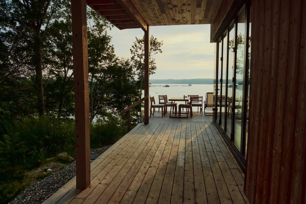 Deck framed by bi-fold doors opening to the Hudson River