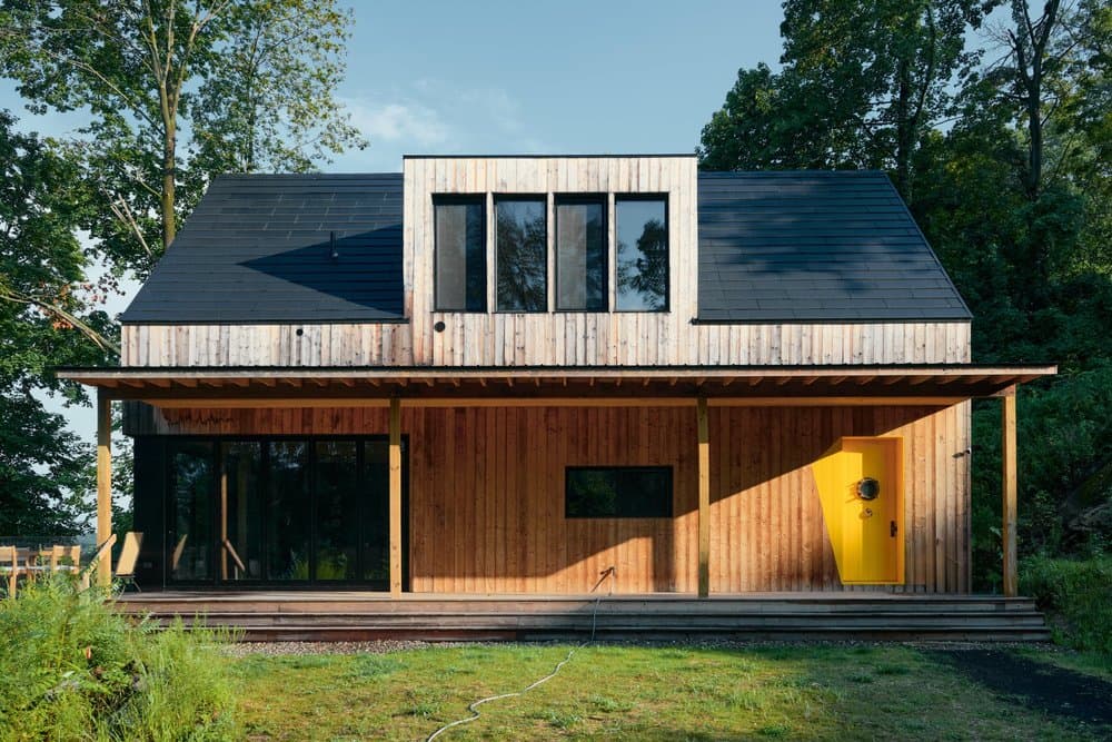 Cedar-clad exterior of the Shatemuc house above the river