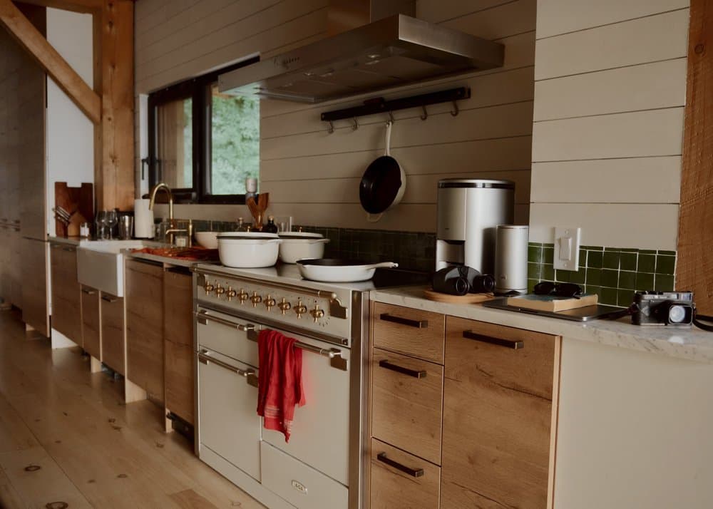 Enormous kitchen with wood cabinetry and open shelving