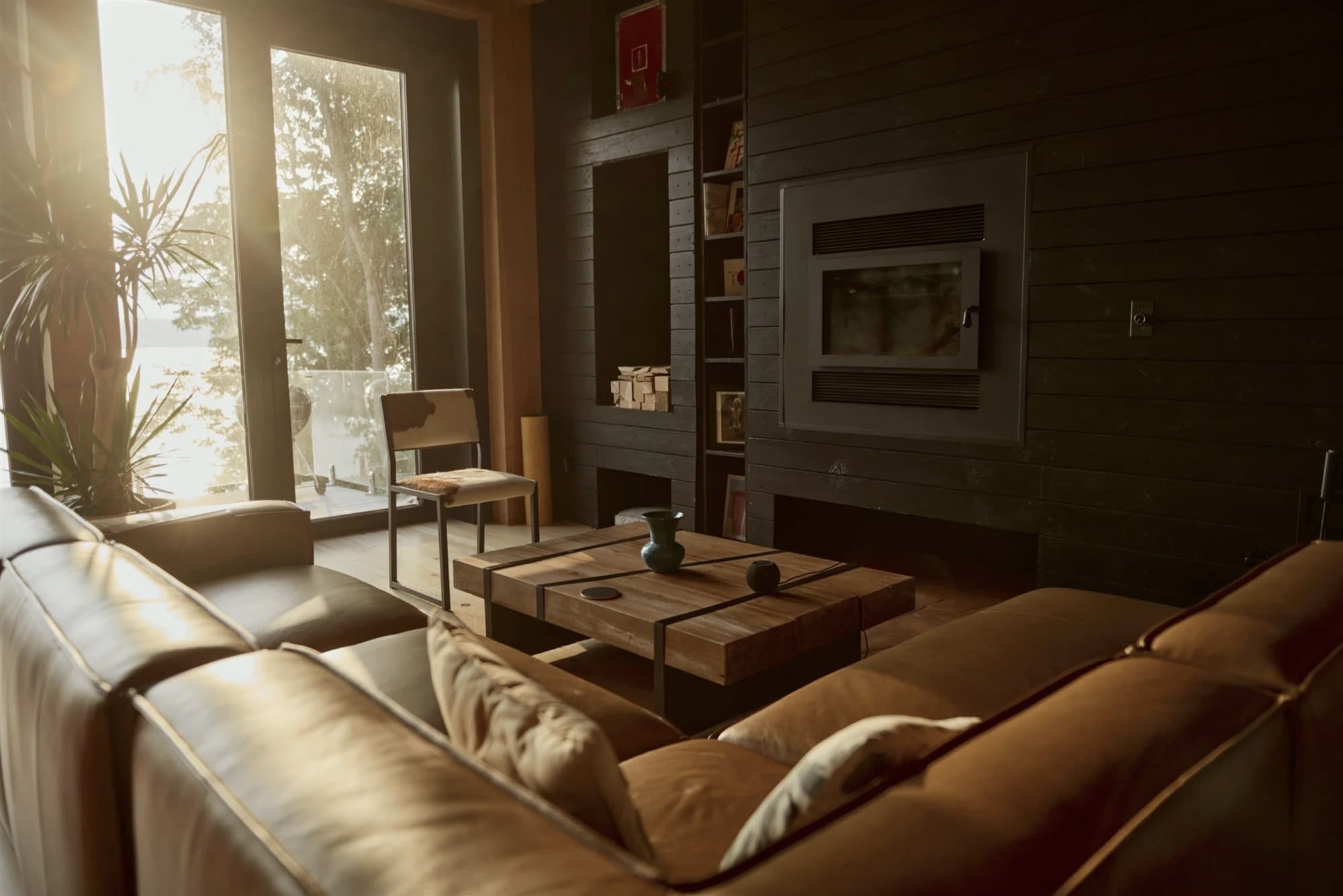 Living area bathed in warm evening light beside the fireplace