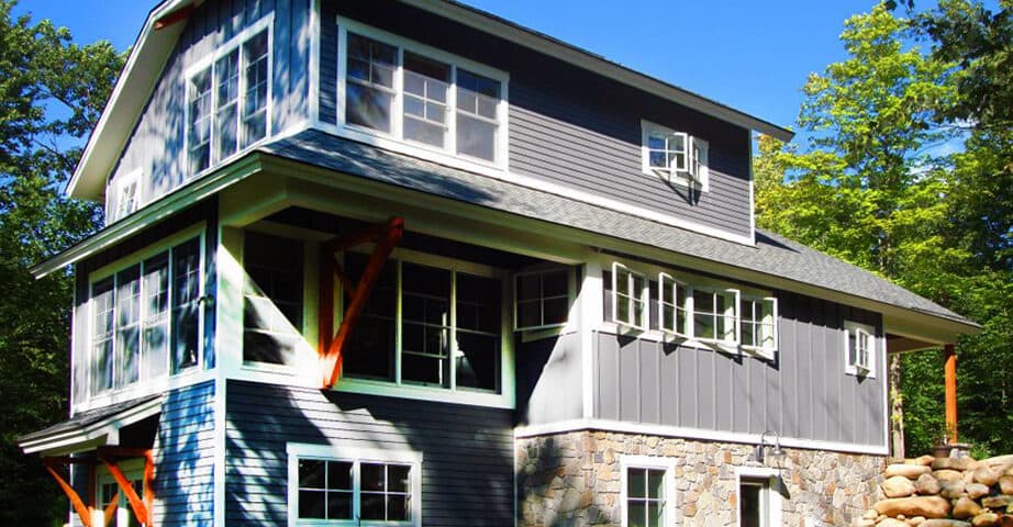 Corner view showing timber brackets and layered rooflines