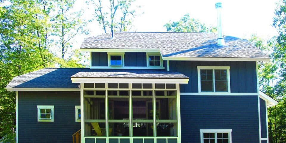 Adirondack-style home with a double-height screened porch