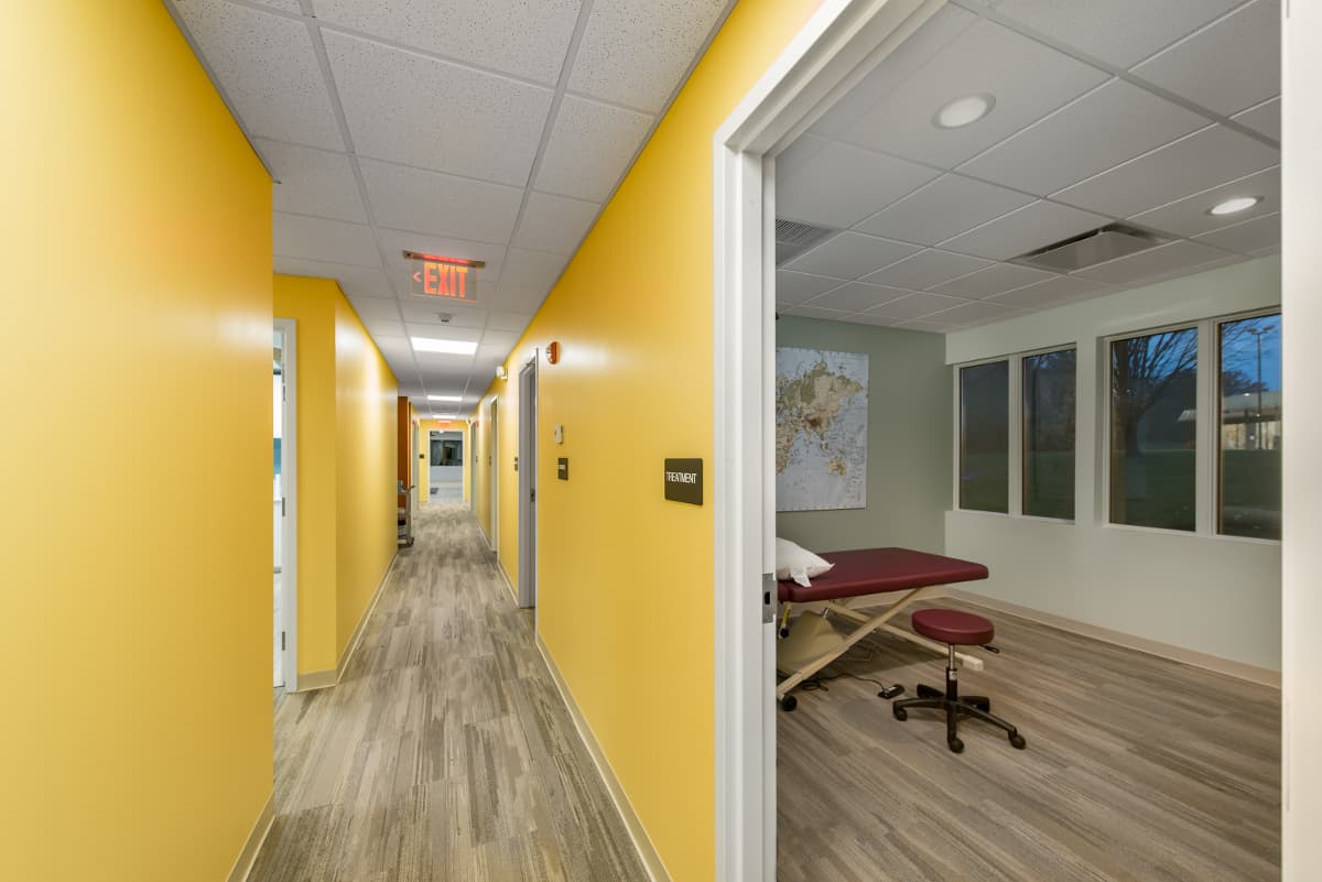 Treatment room corridor with wide accessible clearances
