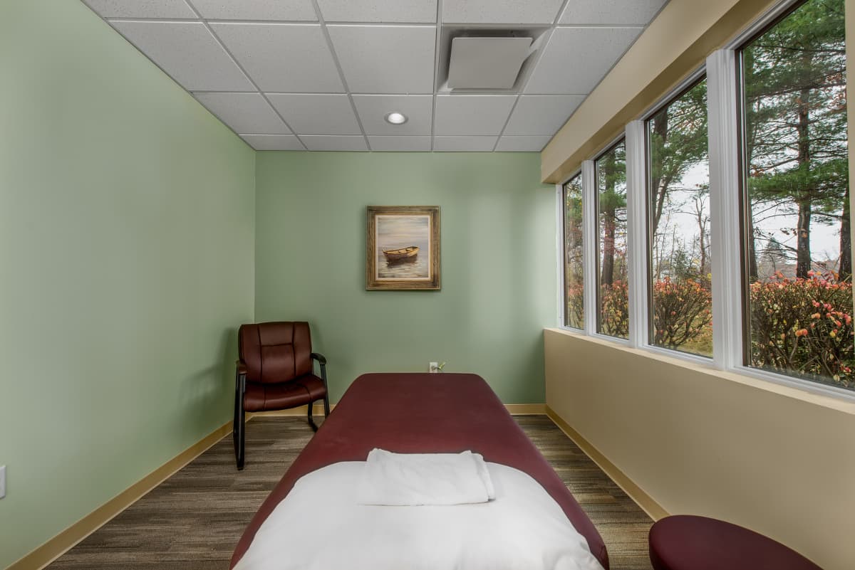 Private treatment room with adjustable bed