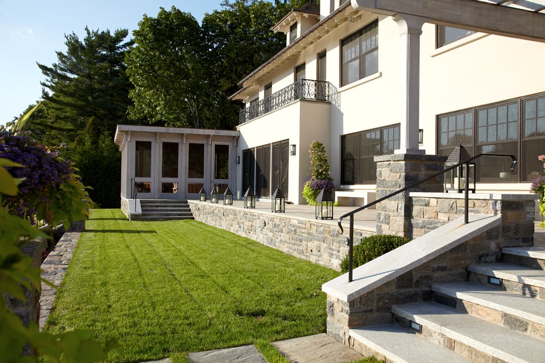 Grass terrace stepping down from the main house