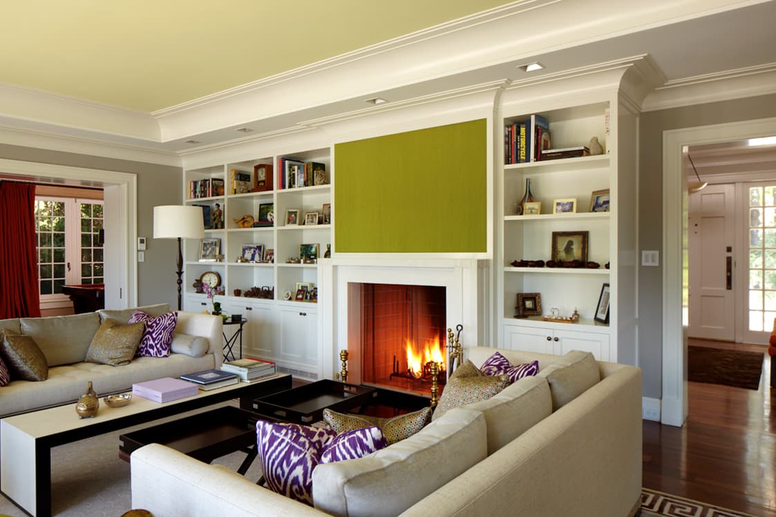 Living room with fireplace and built-in shelving