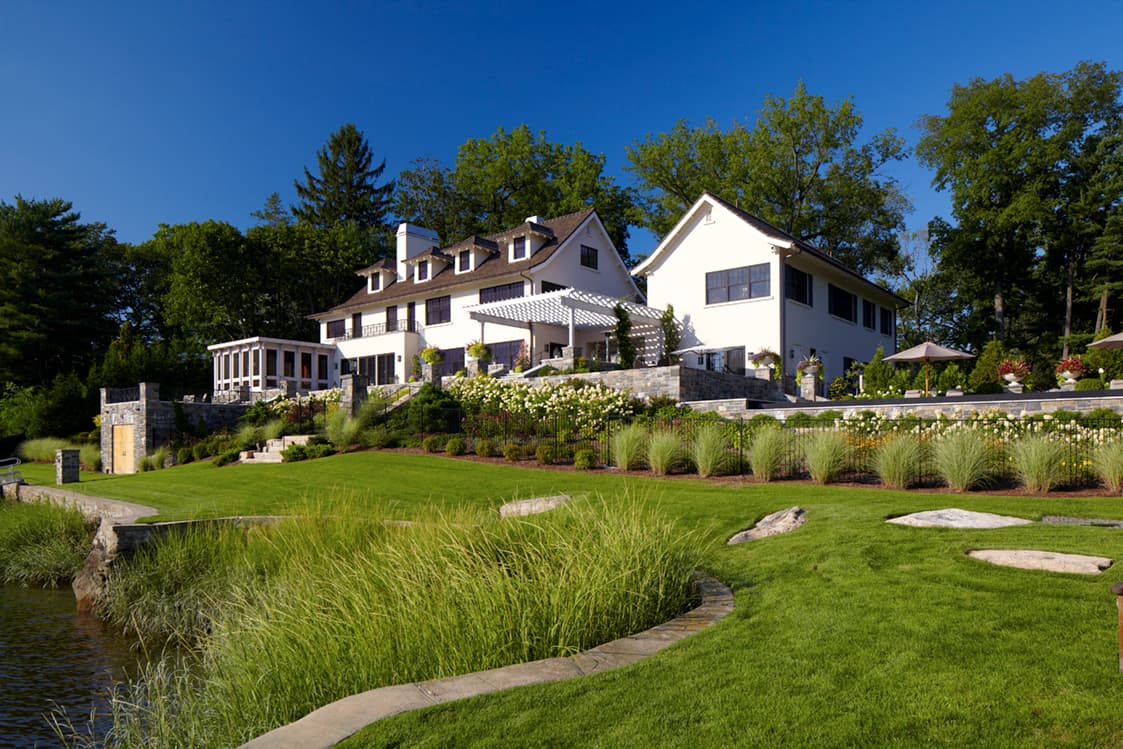 Rear elevation with the new stone terrace and addition