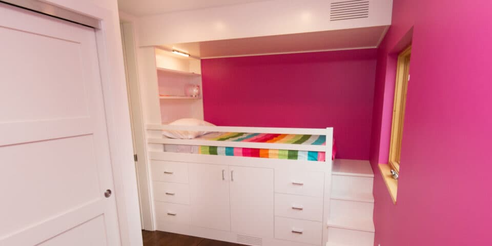 Kids' room with built-in loft bed and storage stair